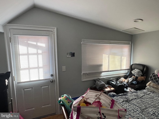 doorway featuring lofted ceiling