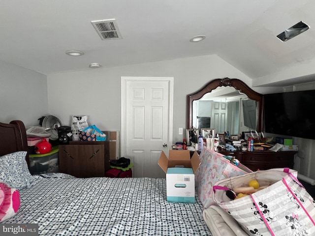 bedroom with lofted ceiling, visible vents, and recessed lighting