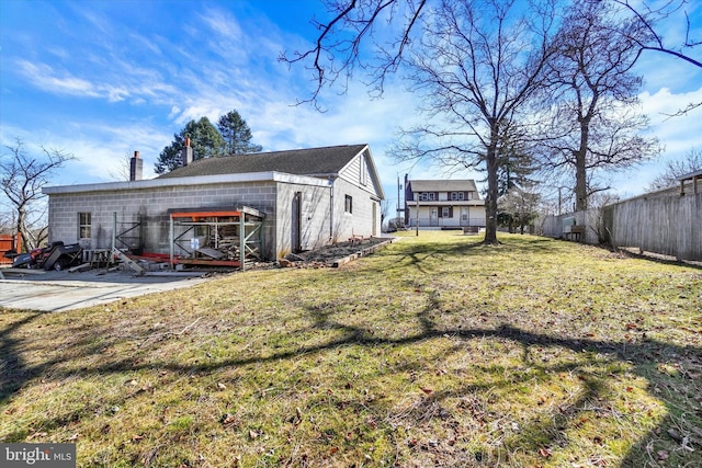 view of yard with a patio and fence