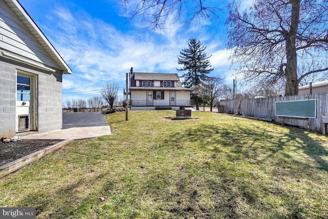 view of yard featuring a patio area and fence