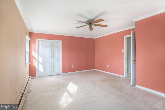 unfurnished bedroom with a baseboard heating unit, carpet, and ornamental molding