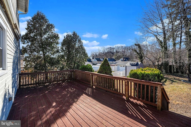 wooden terrace with a residential view