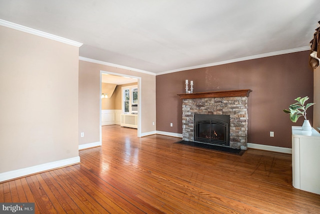 unfurnished living room featuring crown molding, a fireplace, baseboards, and hardwood / wood-style flooring