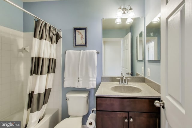 bathroom with vanity, toilet, and shower / bathtub combination with curtain