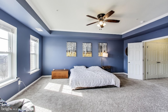 bedroom with visible vents, baseboards, carpet, and ceiling fan