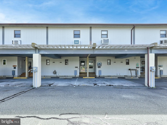 view of property with a parking lot