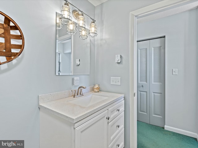 bathroom featuring vanity and baseboards