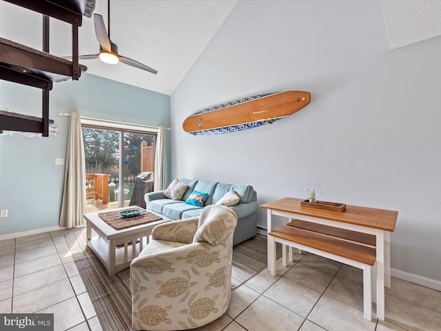 tiled living area with high vaulted ceiling, baseboards, and a ceiling fan