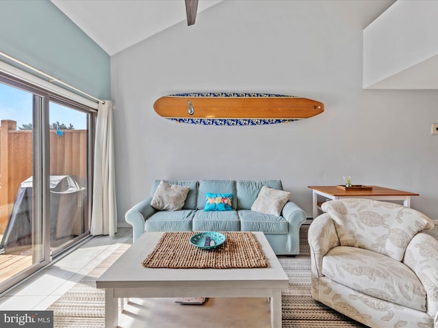 living room featuring light tile patterned floors and lofted ceiling