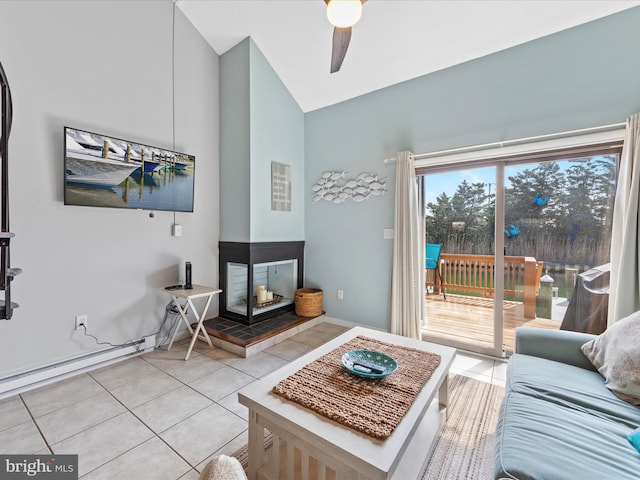 living room with light tile patterned floors, a baseboard radiator, a ceiling fan, and vaulted ceiling