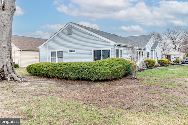 view of home's exterior featuring a yard