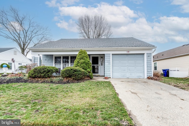 ranch-style house featuring a front lawn, an attached garage, driveway, and roof with shingles