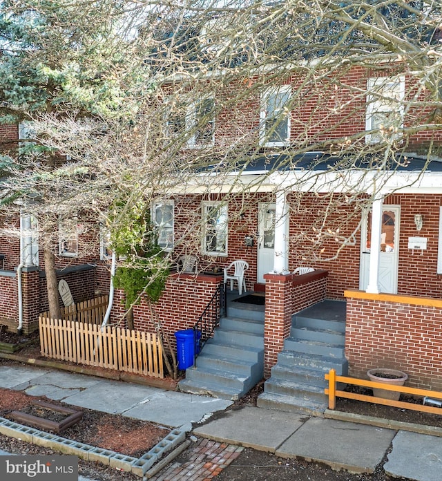 multi unit property with fence and brick siding