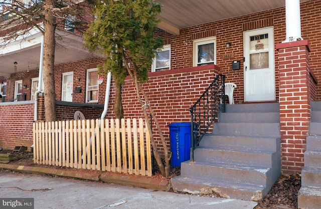 entrance to property with brick siding