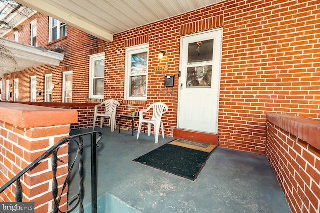 entrance to property with brick siding