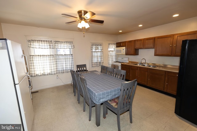 dining space featuring recessed lighting, plenty of natural light, and light floors