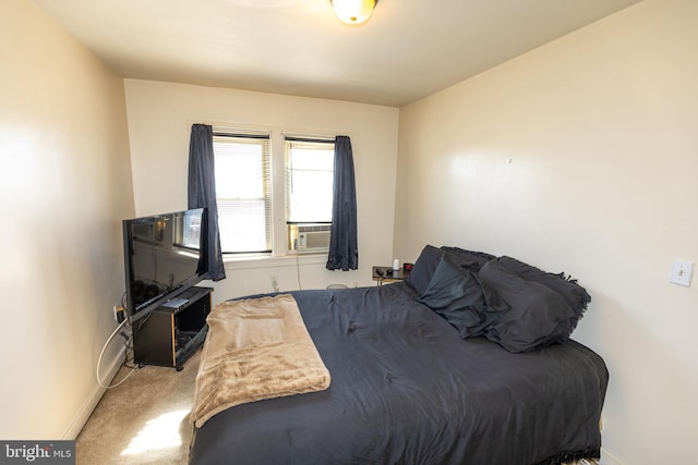 bedroom with carpet, cooling unit, and baseboards