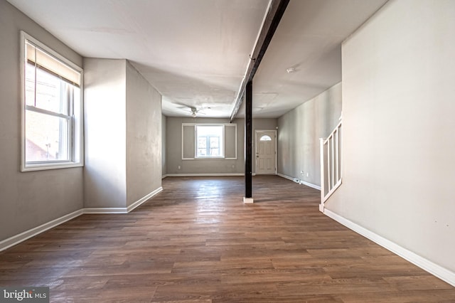 interior space featuring stairs, wood finished floors, and baseboards