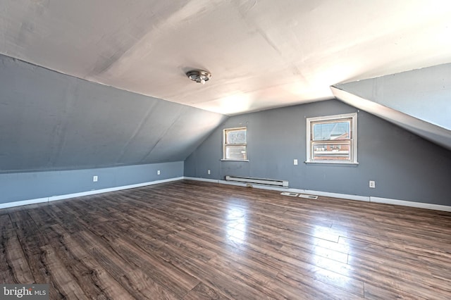 bonus room featuring vaulted ceiling, baseboard heating, and wood finished floors