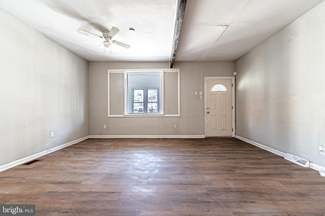 foyer entrance featuring ceiling fan, visible vents, baseboards, and wood finished floors