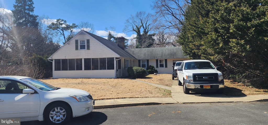 view of front of property with a sunroom