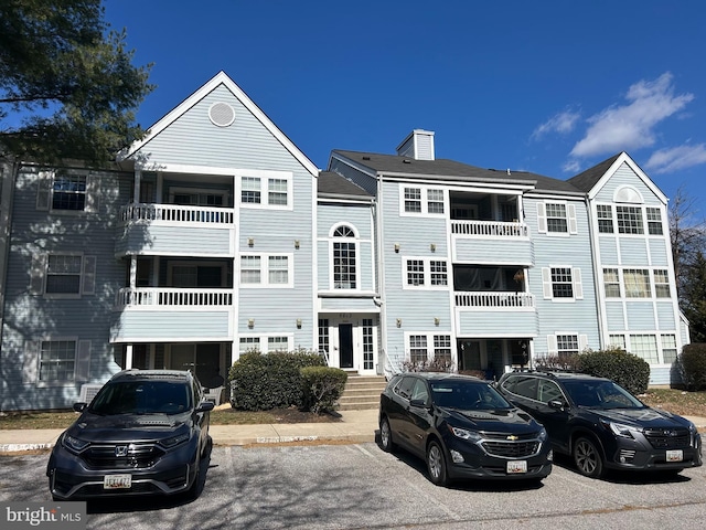 view of property with uncovered parking