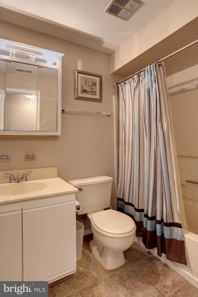 bathroom with visible vents, toilet, vanity, and shower / tub combo with curtain