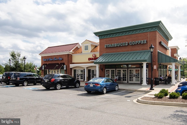 view of property featuring uncovered parking