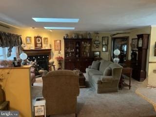 carpeted living room featuring a fireplace