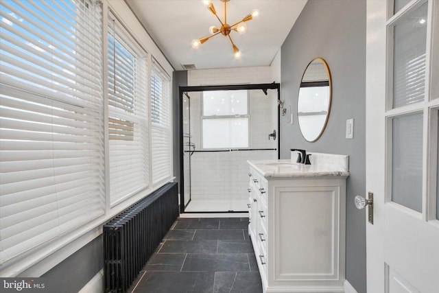 full bathroom with visible vents, a stall shower, vanity, and an inviting chandelier