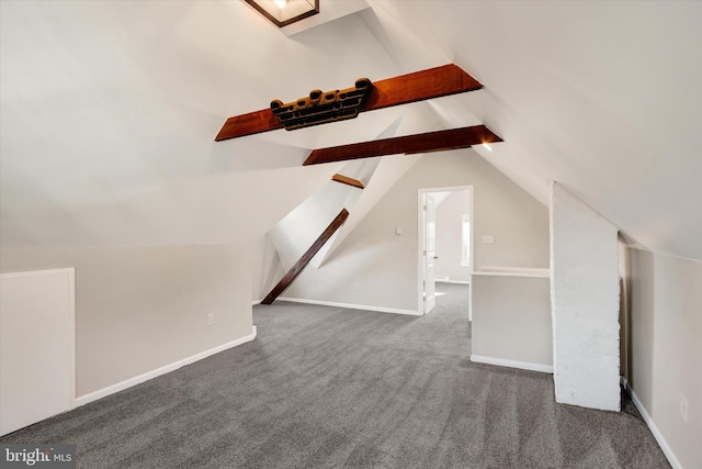 bonus room featuring carpet flooring, vaulted ceiling with beams, and baseboards