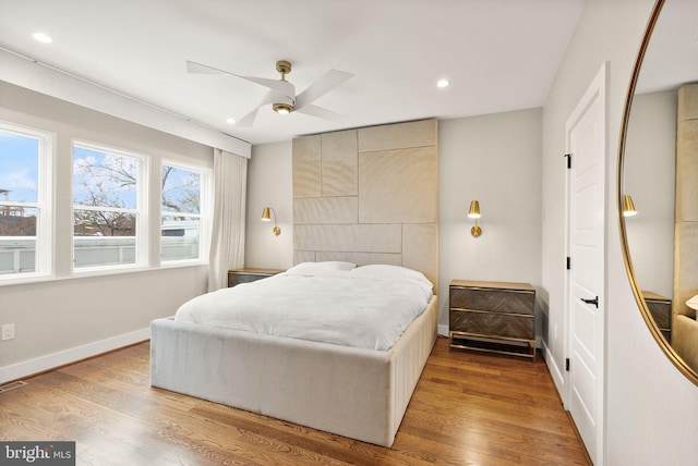 bedroom with recessed lighting, a ceiling fan, baseboards, and wood finished floors