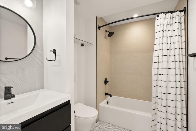 full bathroom featuring vanity, toilet, and shower / tub combo with curtain