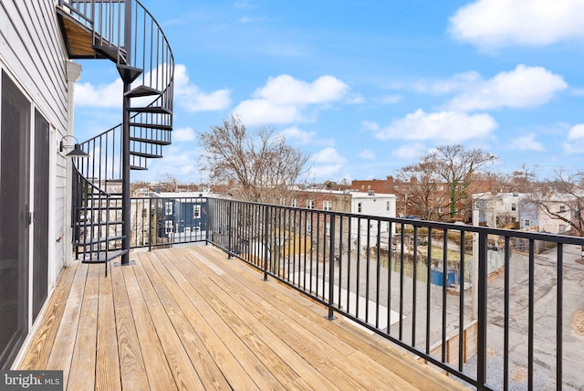 wooden terrace featuring stairway and a residential view