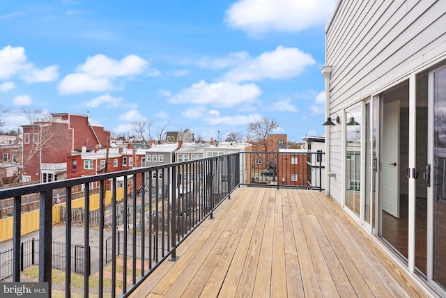 wooden deck featuring a residential view