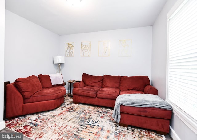 living area featuring baseboards