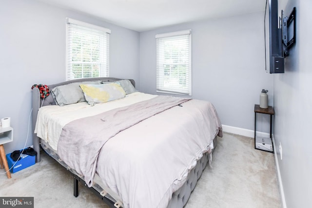 bedroom featuring carpet flooring and baseboards