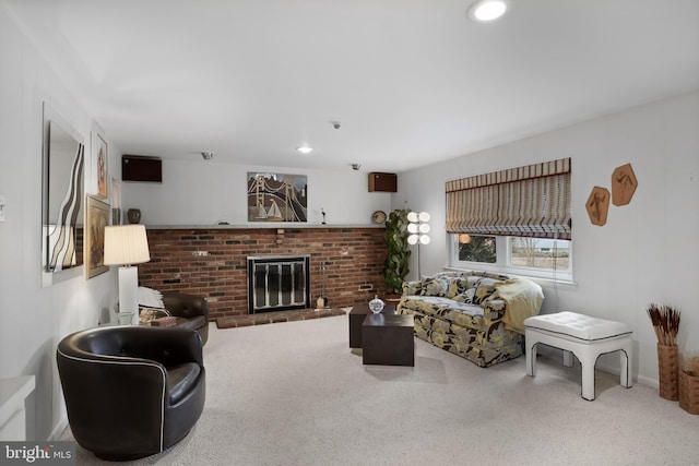 living room with a fireplace and carpet floors