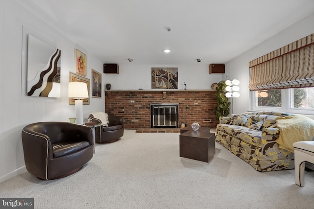 carpeted living room with a fireplace