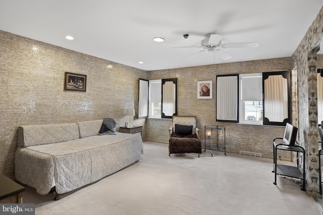 living area with recessed lighting, visible vents, ceiling fan, and carpet flooring