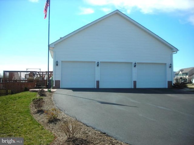 view of property exterior featuring a garage