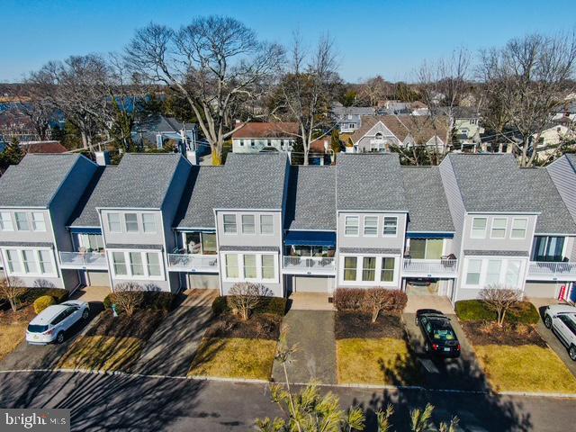 birds eye view of property with a residential view