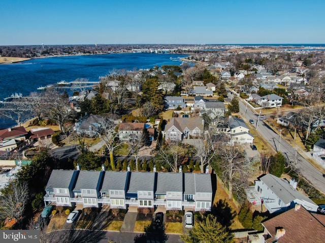 bird's eye view with a water view and a residential view