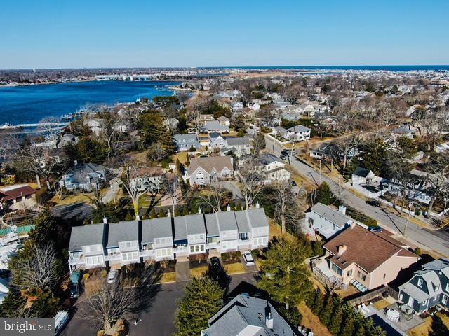 bird's eye view featuring a water view and a residential view