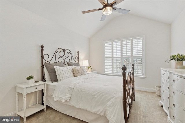 bedroom featuring light carpet, lofted ceiling, a ceiling fan, and baseboards