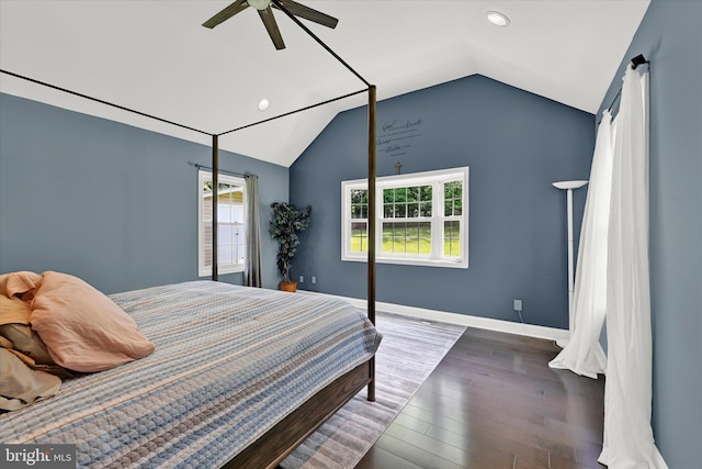 bedroom with lofted ceiling, ceiling fan, baseboards, and wood finished floors