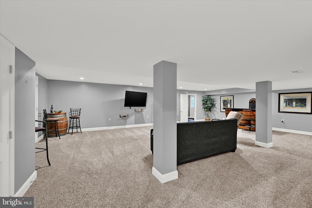 living room with recessed lighting, baseboards, and light colored carpet