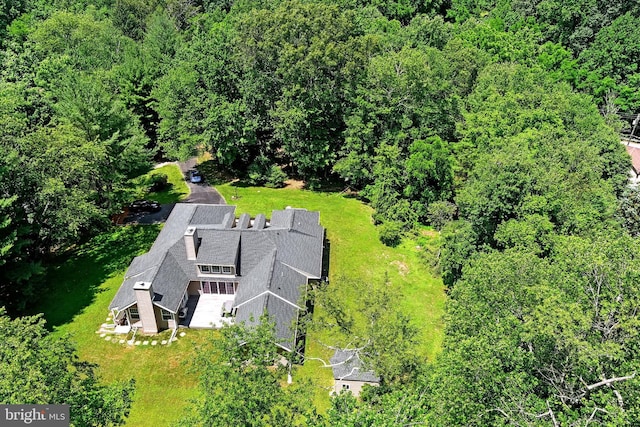 bird's eye view featuring a forest view