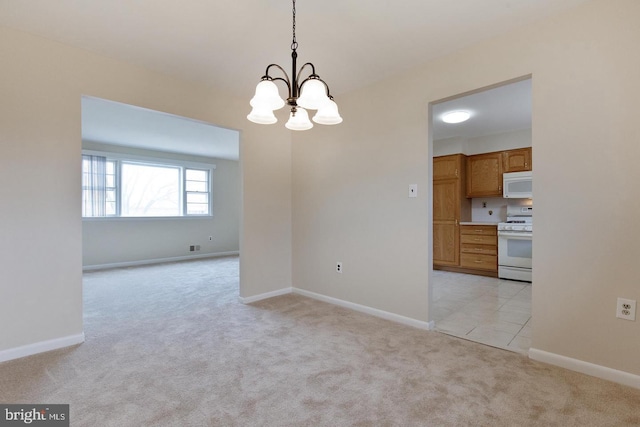 interior space with light carpet, an inviting chandelier, and baseboards