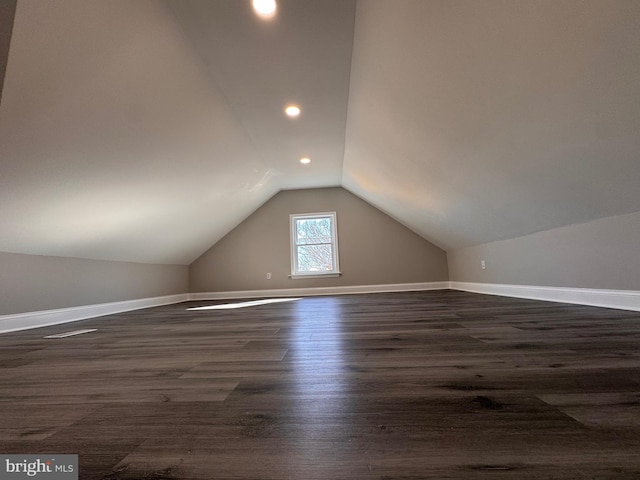 bonus room with recessed lighting, vaulted ceiling, dark wood finished floors, and baseboards